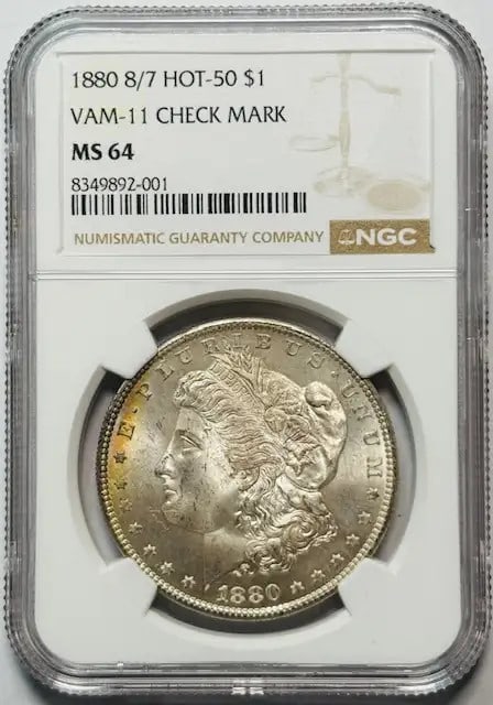 NGC MS64 1880 VAM-11 8 over 7 Morgan Silver Dollar with Check Mark Variety: NGC MS64 1880 VAM-11 8 over 7 Morgan Silver Dollar with Check Mark Variety This is an 1880 Morgan Silver Dollar graded MS-64 by NGC, featuring the 8/7 overdate and VAM-11 variety with a check mark. Th