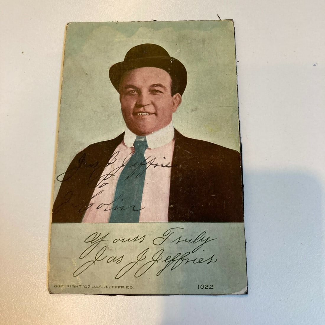 1907 James J. Jeffries Signed Boxing Card with JSA COA: 1907 James J. Jeffries Signed Boxing Card with JSA COA This is an original 1907 boxing fan card featuring the legendary heavyweight champion James J. Jeffries. The card is hand cut and printed on thic