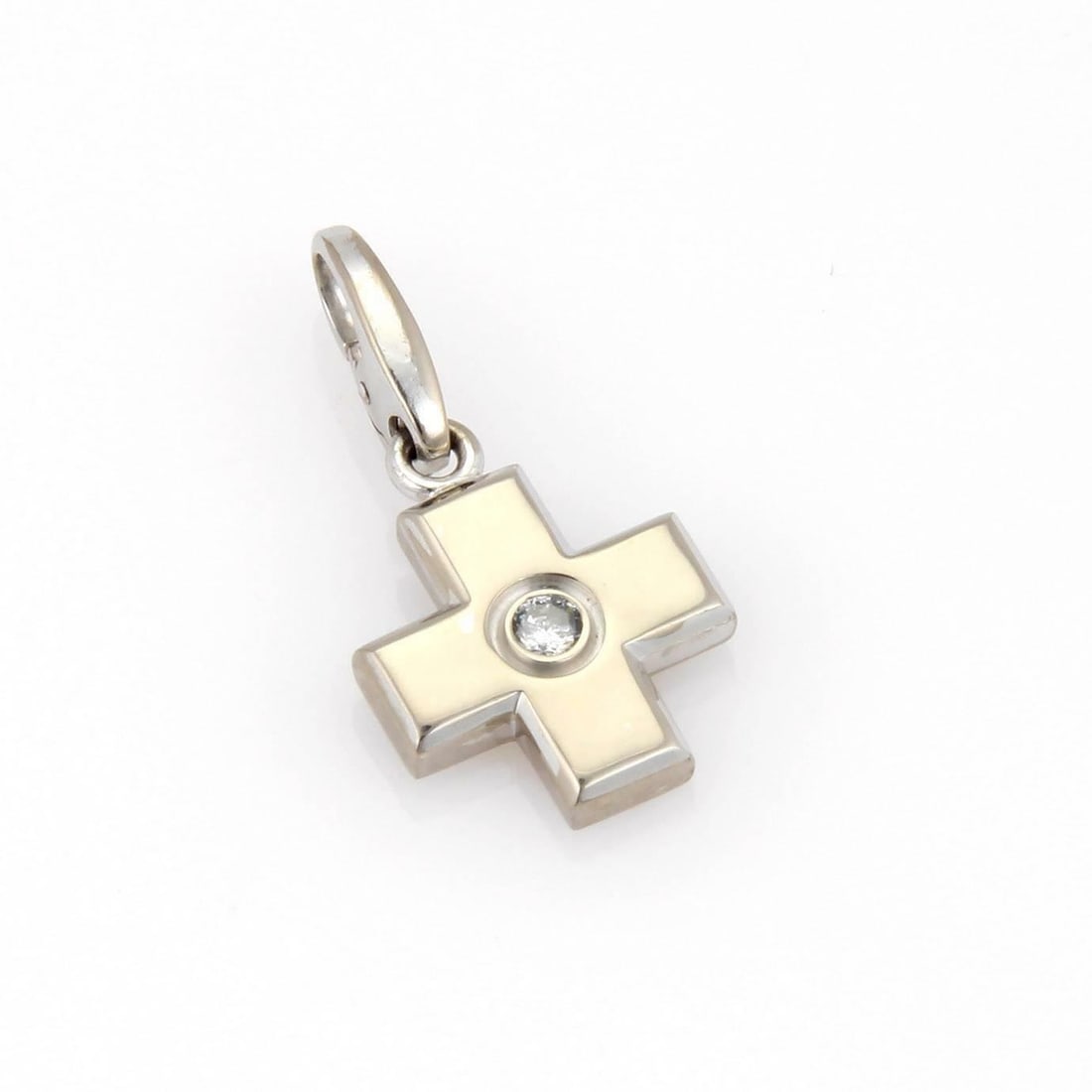 Cartier 18k White Gold Cross Pendant with Diamond Charm: Cartier 18k White Gold Cross Pendant with Diamond Charm This exquisite charm/pendant from Cartier is expertly crafted from 18k white gold, featuring a sleek high-polished finish. The pendant showcases