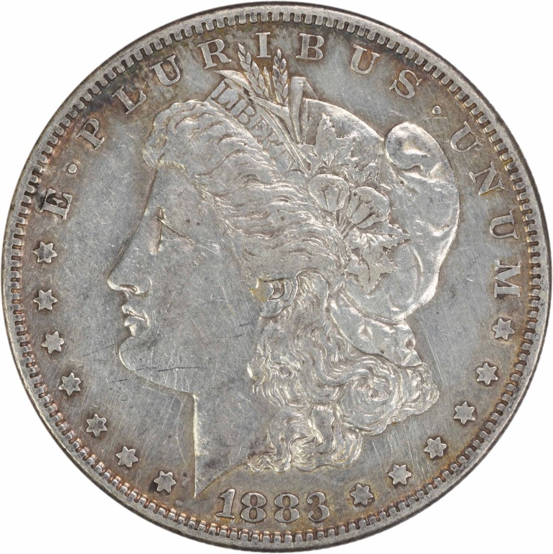 Choice EF 1883 San Francisco Morgan Dollar Uncertified Silver Coin: Choice EF 1883 San Francisco Morgan Dollar Uncertified Silver Coin This 1883-S Morgan Silver Dollar is a circulated coin featuring a 90% silver and 10% copper composition. Struck at the San Francisco