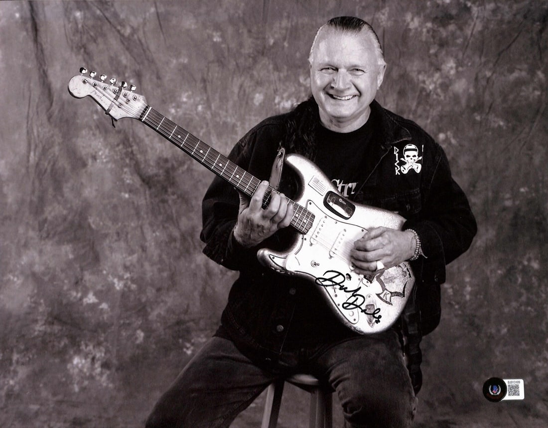 11x14 Photo Autographed by Dick Dale with Beckett Authentication: 11x14 Photo Autographed by Dick Dale with Beckett Authentication This is an original 11x14 photograph signed by the legendary surf guitarist Dick Dale. The autograph, done in black permanent marker, h