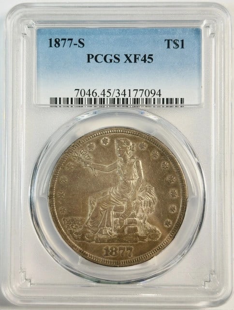 1877 San Francisco Trade Silver Dollar PCGS XF45 Certified: 1877 San Francisco Trade Silver Dollar PCGS XF45 Certified This 1877 S Trade Dollar is composed of silver and has been graded XF 45 by PCGS. Minted in San Francisco, this circulated coin is a collecti