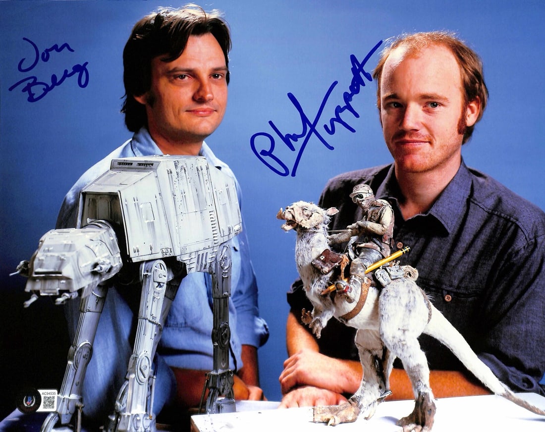 11x14 Photo Signed by Jon Berg and Phil Tippett Beckett 10 Autograph: 11x14 Photo Signed by Jon Berg and Phil Tippett Beckett 10 Autograph This is an 11x14 photograph autographed in blue ink by ILM artists Jon Berg and Phil Tippett from Star Wars: The Empire Strikes Bac