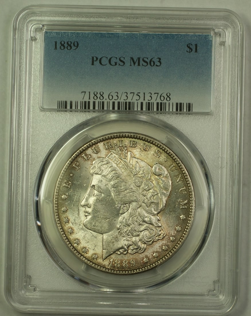 PCGS MS63 1889 Silver Morgan Dollar Uncirculated Philadelphia Lightly Toned: PCGS MS63 1889 Silver Morgan Dollar Uncirculated Philadelphia Lightly Toned This 1889 Morgan Silver Dollar features a light toning and is certified by PCGS with a grade of MS-63. Struck at the Philade