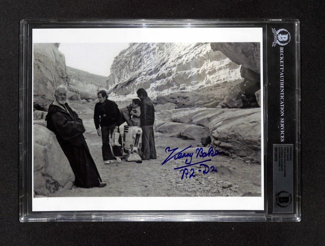 Kenny Baker Signed 8x10 Photo as R2-D2 with Beckett 10 Auto Grade: Kenny Baker Signed 8x10 Photo as R2-D2 with Beckett 10 Auto Grade This is an original 8x10 black and white photograph signed by Kenny Baker, who portrayed R2-D2 in Star Wars: A New Hope. The autograph