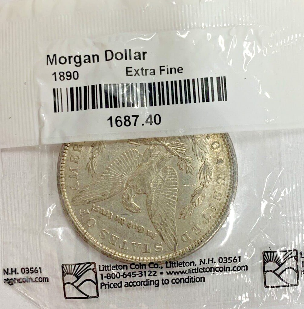 1890 Silver Morgan Dollar Coin Philadelphia Circulated Example: 1890 Silver Morgan Dollar Coin Philadelphia Circulated Example This 1890 Morgan Silver Dollar features a circulated condition and is composed of silver. Minted in Philadelphia, it is an ungraded and u