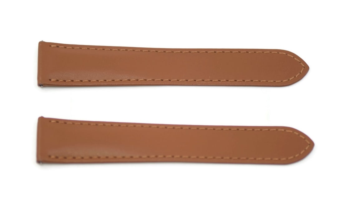 Cartier Authentic Brown Leather Watch Strap 21mm: Cartier Authentic Brown Leather Watch Strap 21mm This authentic Cartier brown leather strap is designed for wristwatches, featuring a sleek and sophisticated appearance. The strap is made of high-qual