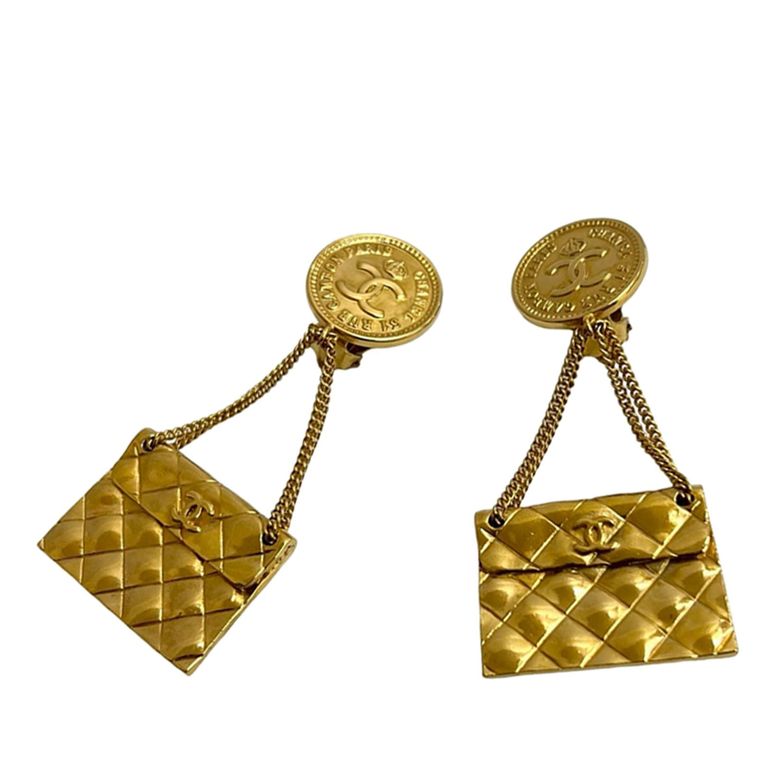 Chanel Classic Quilted Medallion Gold Plated Clip On Earrings: Chanel Classic Quilted Medallion Gold Plated Clip On Earrings These Chanel earrings feature gold plated metal bodies with a classic quilted flap medallion design and clip-on closures. Made in France,