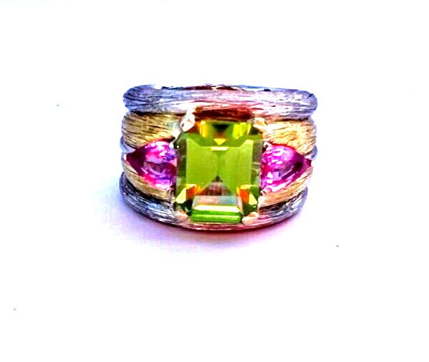 French 950 Platinum 18K Yellow Gold Peridot Pink Sapphire Ring Size 7.25: French 950 Platinum 18K Yellow Gold Peridot Pink Sapphire Ring Size 7.25 This stunning French ring features exquisite craftsmanship in a blend of 950 platinum and 18K yellow gold. Highlighted by a vib