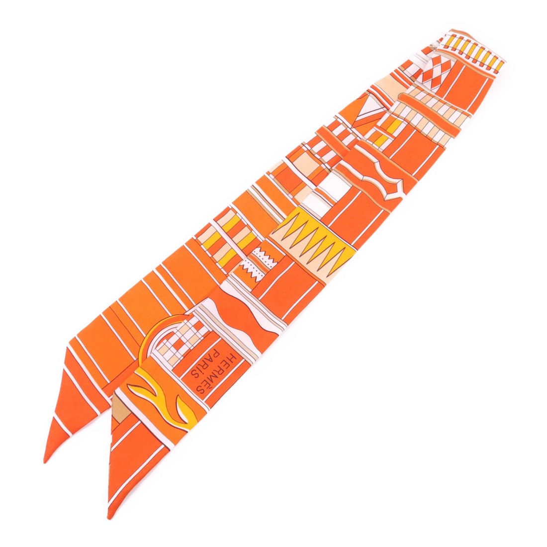 Orange Silk Twilly Scarf by Hermes France: Orange Silk Twilly Scarf by Hermes France This Hermes Twilly scarf is crafted from luxurious silk in an elegant orange shade. Made in France, it features a classic design that adds a touch of sophisti