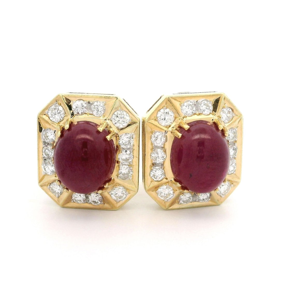 GIA Certified 11ctw No Heat Cabochon Ruby Diamond Omega Earrings in Yellow Gold: GIA Certified 11ctw No Heat Cabochon Ruby Diamond Omega Earrings in Yellow Gold These exquisite earrings showcase (2) natural genuine rubies, each featuring an oval cabochon cut with a purplish red co