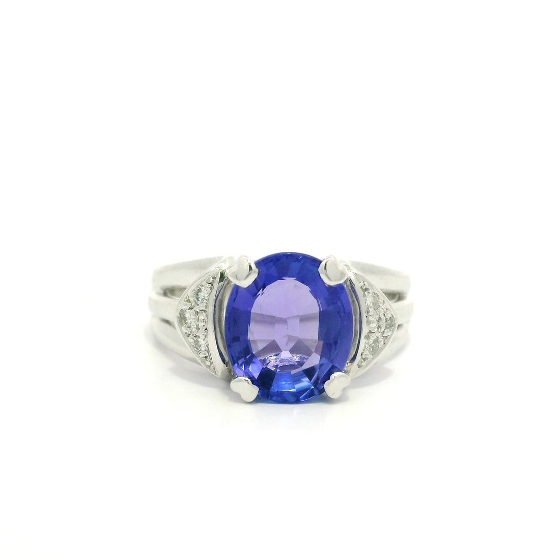 Platinum GIA Certified 2.81ct Oval Tanzanite Diamond Cocktail Ring: Platinum GIA Certified 2.81ct Oval Tanzanite Diamond Cocktail Ring This exquisite cocktail ring features a stunning 2.75ct natural oval tanzanite, beautifully prong set in solid platinum with a GIA ce