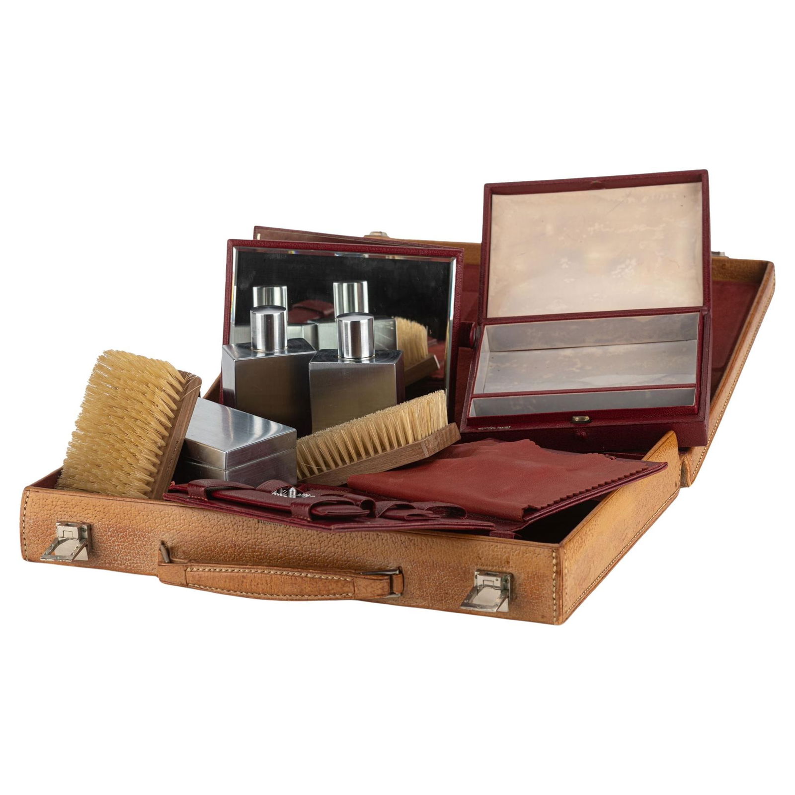 Vintage Caramel Leather Grooming Set with Accessories by Hermes: Vintage Caramel Leather Grooming Set with Accessories by Hermes This vintage Hermes grooming travel set includes a leather luggage case containing two silver metal bottles, one silver metal box, two w