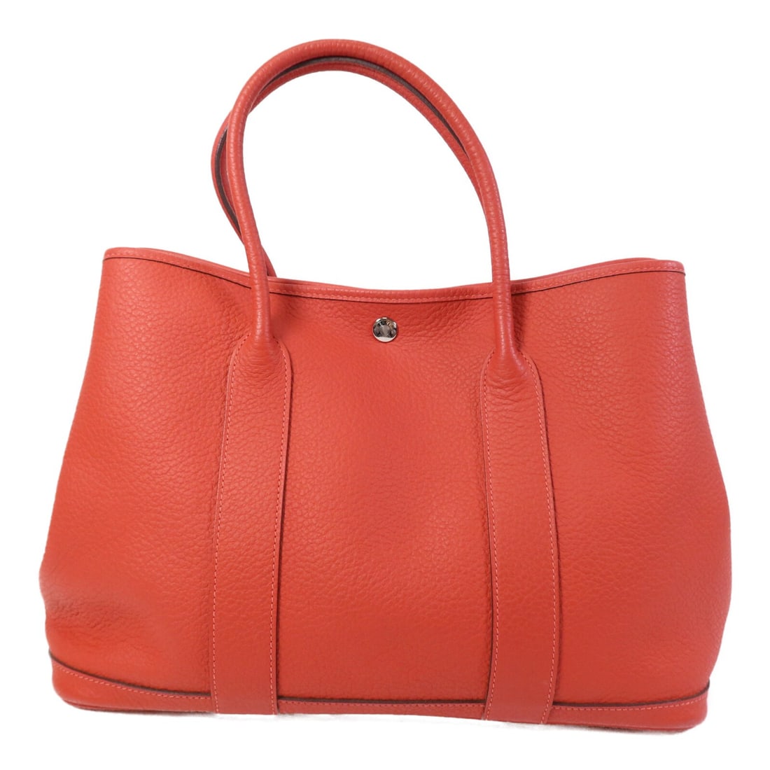 Hermes Garden Party PM Red Calfskin Tote with Palladium Hardware: Hermes Garden Party PM Red Calfskin Tote with Palladium Hardware This HERMES Garden Party PM handbag is crafted from Negonda calfskin leather in a striking red hue, known as Rouge Pivoine. It features
