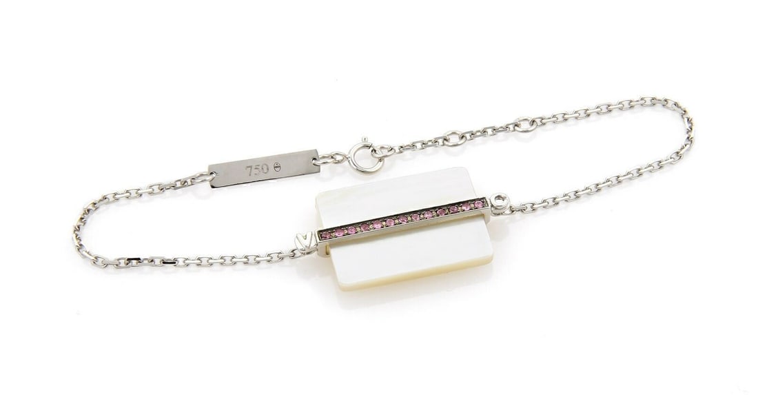 Victoria Casal 18k White Gold Bracelet with Pink Sapphires and Pink Mother of Pearl: Victoria Casal 18k White Gold Bracelet with Pink Sapphires and Pink Mother of Pearl This Victoria Casal bracelet features an identity style crafted from 18k white gold. It is adorned with thirteen pin