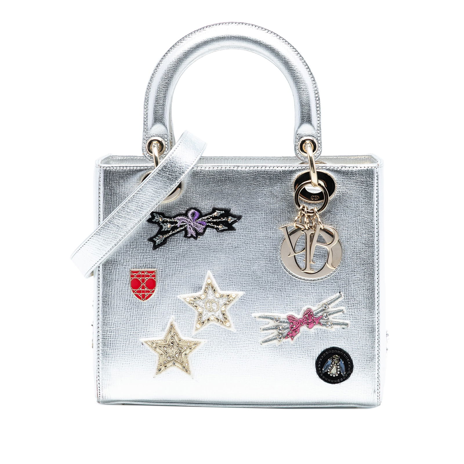 Dior Lady Dior Medium Silver Leather Bag with Patch Embellishments: Dior Lady Dior Medium Silver Leather Bag with Patch Embellishments This Lady Dior handbag features a leather body with patch embellishments, flat leather top handles, a detachable flat leather strap,