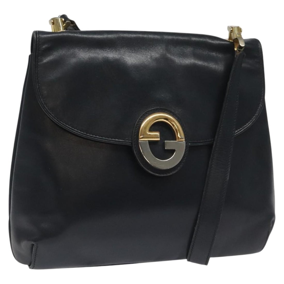 Gucci Navy Leather Vintage Shoulder Purse from Italy: Gucci Navy Leather Vintage Shoulder Purse from Italy This Gucci vintage shoulder bag is crafted from navy leather and designed for women. Made in Italy, it features a spacious interior and classic sty