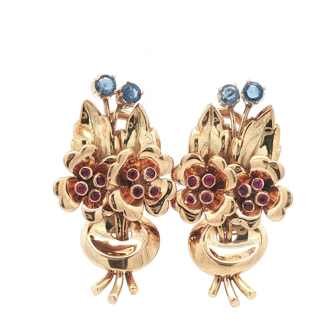 Vintage Retro 18k Gold Floral Sapphire Ruby Omega Earrings: Vintage Retro 18k Gold Floral Sapphire Ruby Omega Earrings Discover the elegance of these Vintage Retro 18k Yellow Gold Omega Earrings, featuring a stunning floral design. The earrings showcase four n