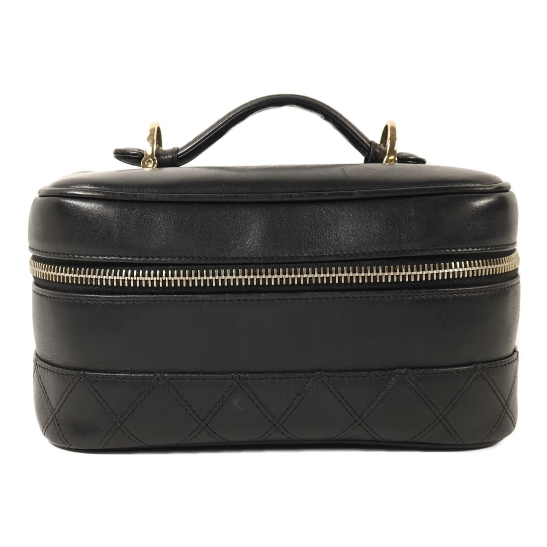 Black Calfskin CHANEL Vanity Case Handbag with CC Logo and Gold Hardware: Black Calfskin CHANEL Vanity Case Handbag with CC Logo and Gold Hardware This CHANEL Vintage Vanity Case Handbag is crafted from black calfskin leather, featuring the iconic CC logo. The bag is design