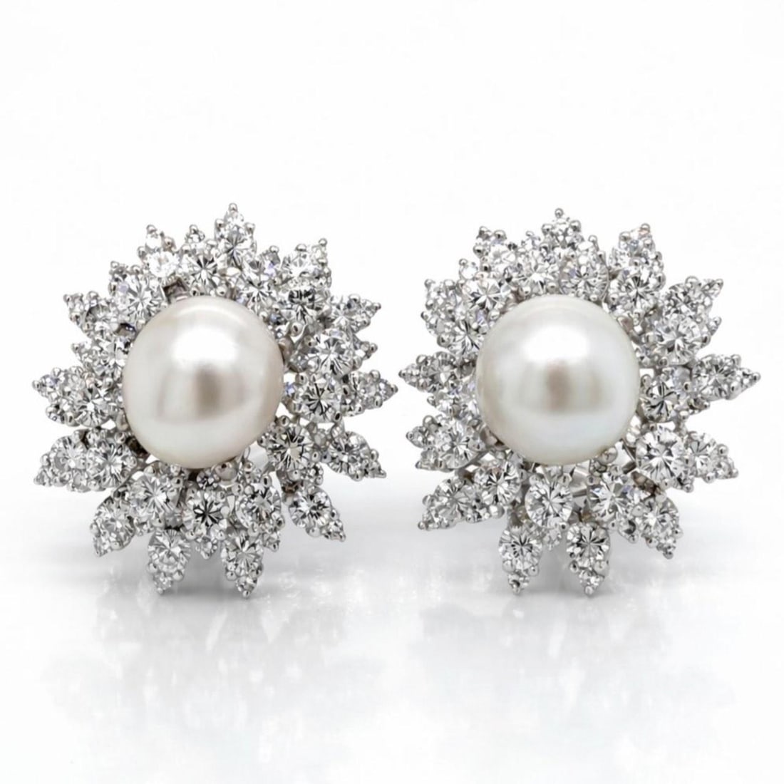 Platinum Earrings With 11ct Diamonds and South Sea Pearls From 1950s: Platinum Earrings With 11ct Diamonds and South Sea Pearls From 1950s Elegant earrings from the 1950s crafted in platinum, featuring a total of 156 diamonds with an approximate combined weight of 11.00