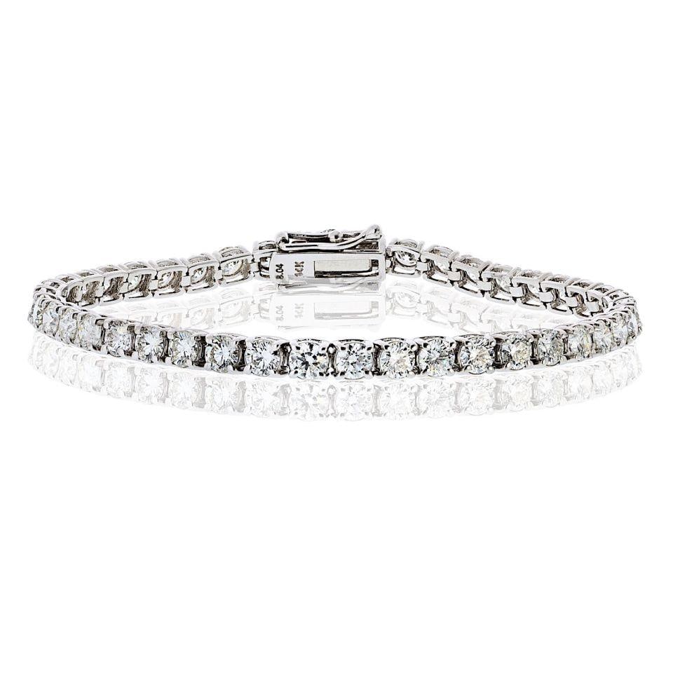 14K White Gold 8.04ct Diamond Classic Tennis Bracelet: 14K White Gold 8.04ct Diamond Classic Tennis Bracelet This exquisite tennis bracelet is crafted from 14K white gold, showcasing a total of 42 round brilliant-cut natural diamonds. Each diamond weighs