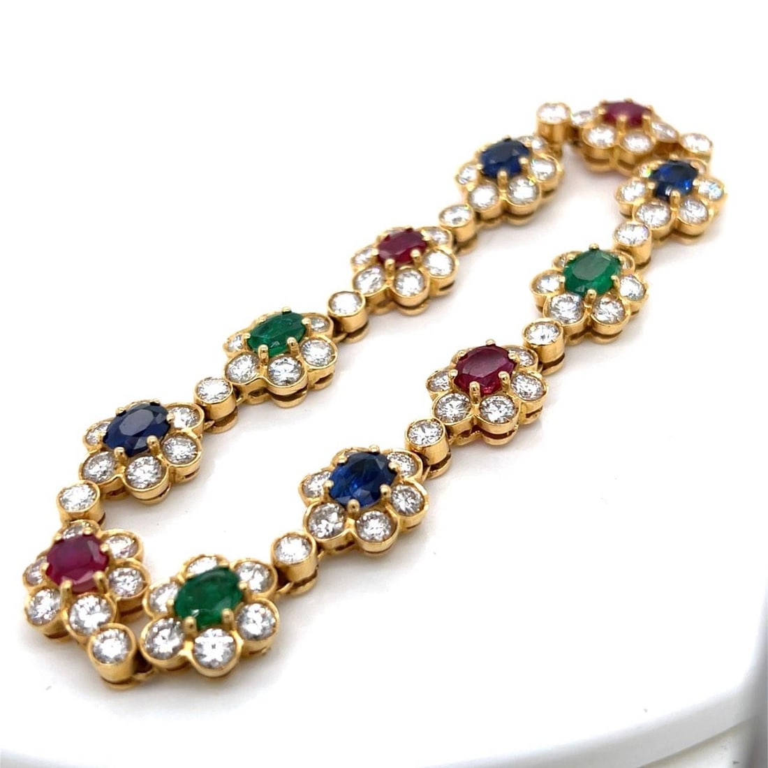 18K Yellow Gold Ruby Sapphire Emerald Diamond Jewelry Set: 18K Yellow Gold Ruby Sapphire Emerald Diamond Jewelry Set This exquisite set features an 18K yellow gold necklace and bracelet adorned with an array of vibrant gemstones. The necklace measures 16.75 i