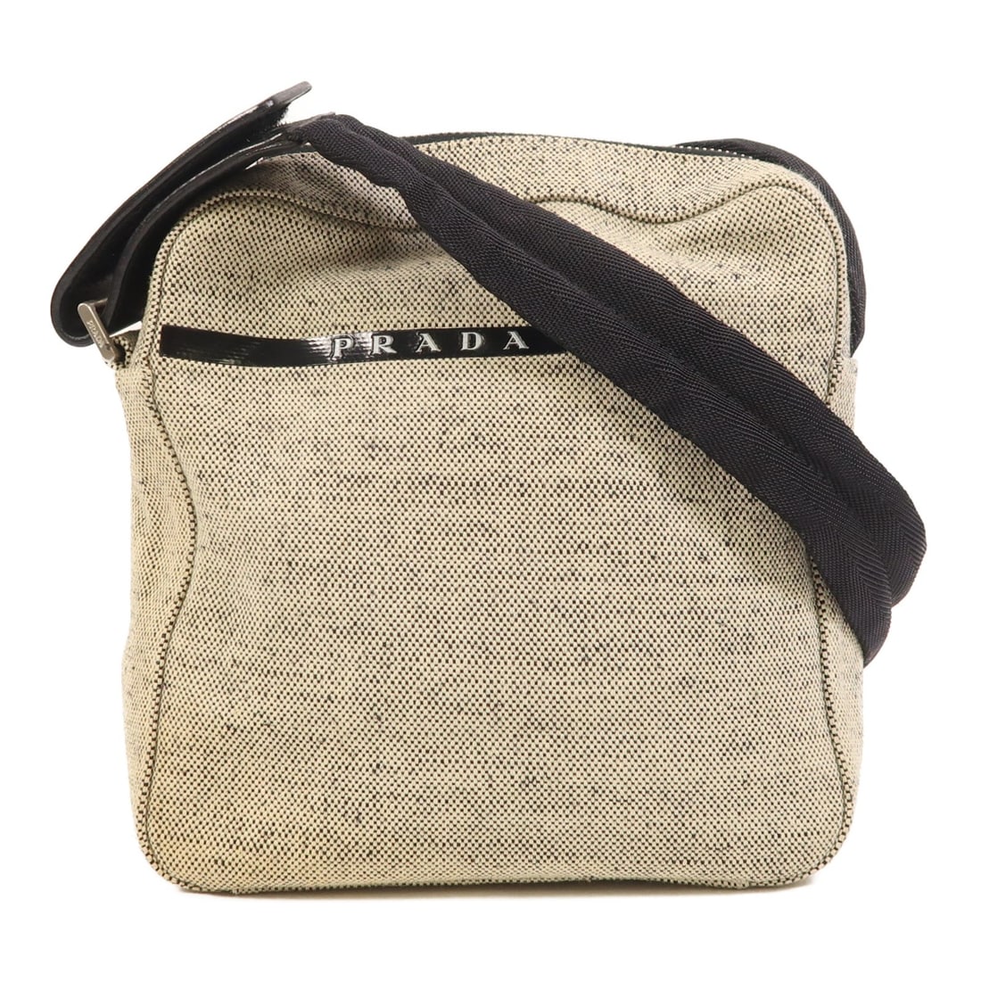 Beige Canvas Shoulder Bag by Prada with Silver Tone Hardware: Beige Canvas Shoulder Bag by Prada with Silver Tone Hardware This PRADA shoulder bag features a beige canvas exterior and a matching beige frame. Designed in a regular size, it offers practical dimens