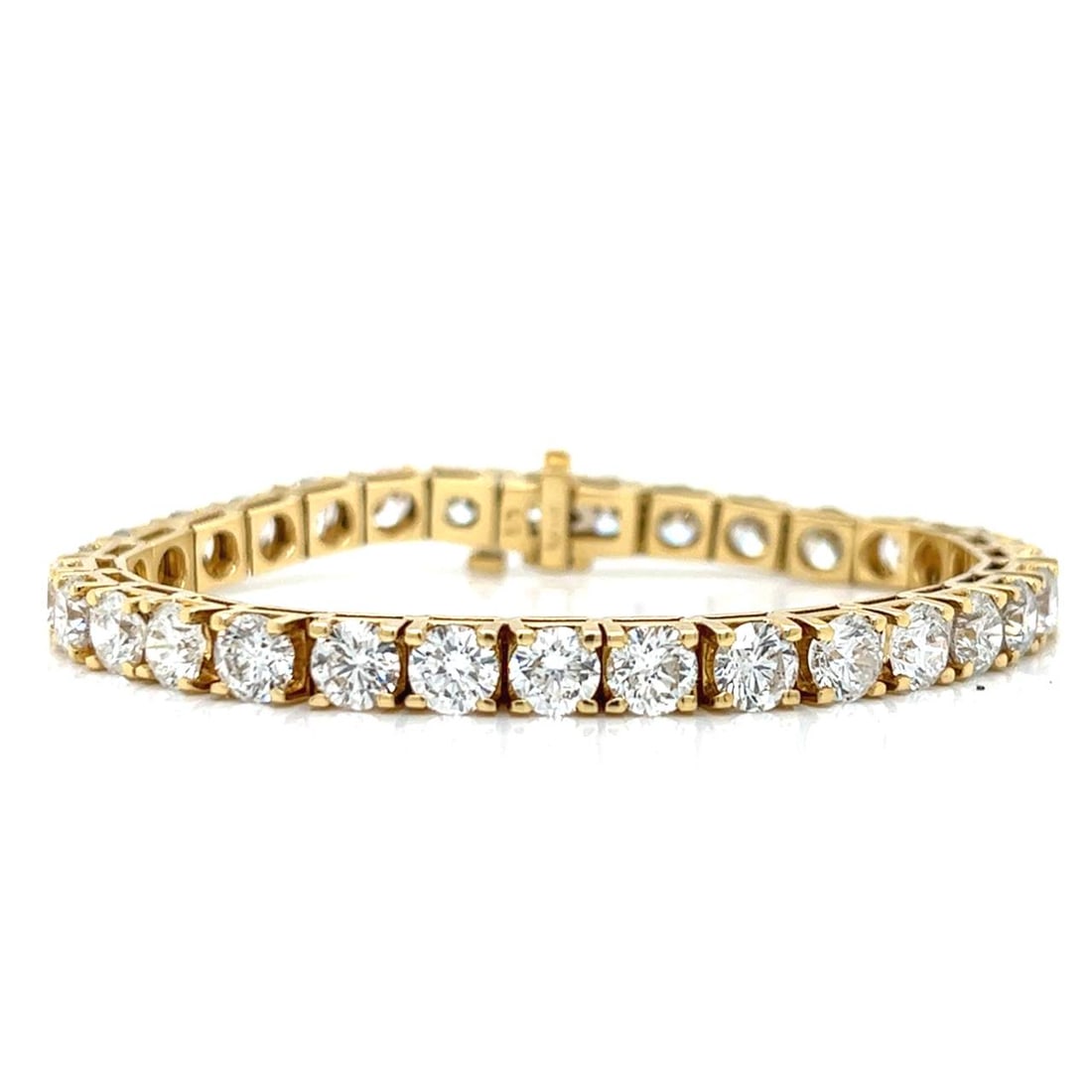 18K Yellow Gold 16.00 Ct Diamond Tennis Bracelet 31 Diamonds G-H SI1-SI2: 18K Yellow Gold 16.00 Ct Diamond Tennis Bracelet 31 Diamonds G-H SI1-SI2 This exquisite 18K yellow gold tennis bracelet features a stunning arrangement of 31 diamonds totaling approximately 16.00 cara