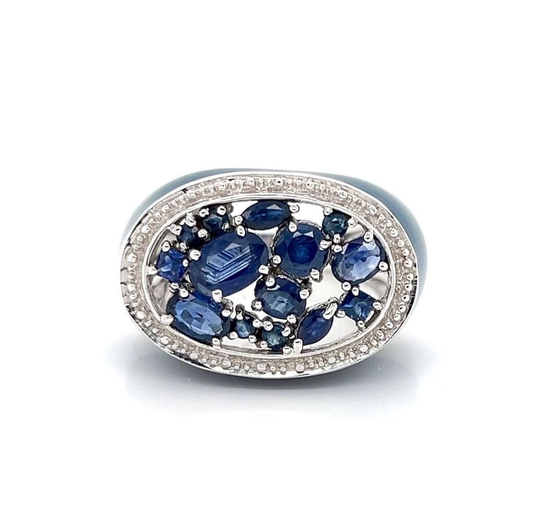 Ring with Blue Sapphire and Enamel in 14k White Gold Size 7: Ring with Blue Sapphire and Enamel in 14k White Gold Size 7 This ring showcases a bold top design, expertly crafted in solid 14k white gold. It features a deep blue sapphire centerpiece accented by ri