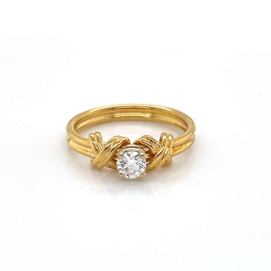 Signature X solitaire diamond ring in 18k yellow gold by Tiffany size 5: Signature X solitaire diamond ring in 18k yellow gold by Tiffany size 5 This Tiffany & Co. Signature X solitaire ring features a center diamond set in 18k yellow gold. The ring is hallmarked with Tiff