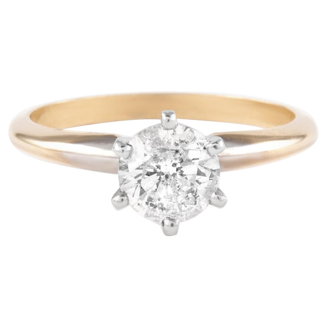 0.94 Carat Two Tone Round Brilliant Diamond Ring 14K Tiffany Style: 0.94 Carat Two Tone Round Brilliant Diamond Ring 14K Tiffany Style This stunning 0.94 Carat Round Brilliant Solitaire Diamond Ring features a contemporary design with a classic "Tiffany style setting.
