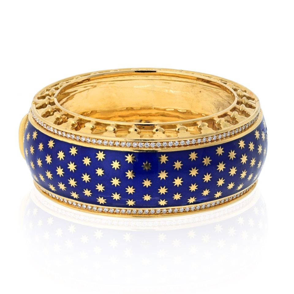 Tiffany & Co. Paloma Picasso 18K Gold Blue Enamel Diamond Bracelet: Tiffany & Co. Paloma Picasso 18K Gold Blue Enamel Diamond Bracelet This stunning bracelet from Tiffany & Co., designed by Paloma Picasso, showcases a luxurious blend of materials including 18K yellow