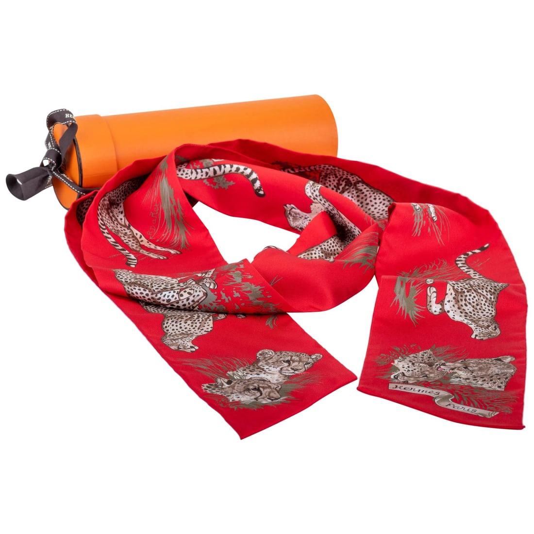 Hermes Red Guepards Maxi Twilly Silk Scarf New in Box: Hermes Red Guepards Maxi Twilly Silk Scarf New in Box Elevate your accessory collection with this exquisite Hermes Red Guepards Maxi Twilly Thin Scarf. Crafted from 100% silk, this luxurious scarf sho