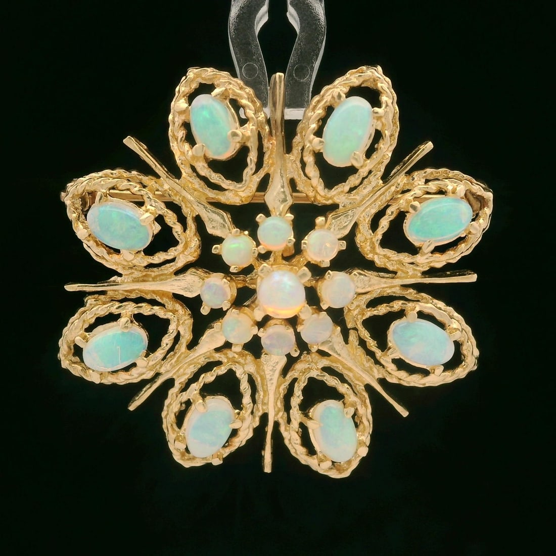 Vintage 14K Yellow Gold Floral Opal Brooch Pendant with Natural Cabochons: Vintage 14K Yellow Gold Floral Opal Brooch Pendant with Natural Cabochons This exquisite vintage floral pin brooch pendant features a stunning arrangement of 17 natural genuine opals, including 9 roun
