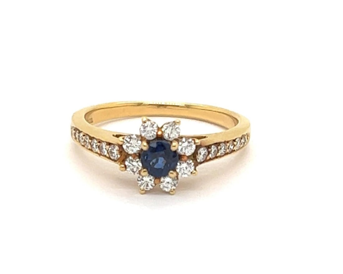 18k Yellow Gold Tiffany Diamond and Sapphire Ring in Size 6.5: 18k Yellow Gold Tiffany Diamond and Sapphire Ring in Size 6.5 This Tiffany & Co. ring features a sparkling 0.29ct diamond and a 0.30ct sapphire set in 18k yellow gold. The vintage piece is signed by T
