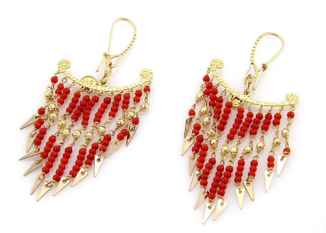 18k Yellow Gold Dangle Earrings with Multiple Coral Bead Strands: 18k Yellow Gold Dangle Earrings with Multiple Coral Bead Strands These chandelier earrings feature multiple strands of colorful coral beads suspended from an 18k yellow gold setting in a dangle/drop s