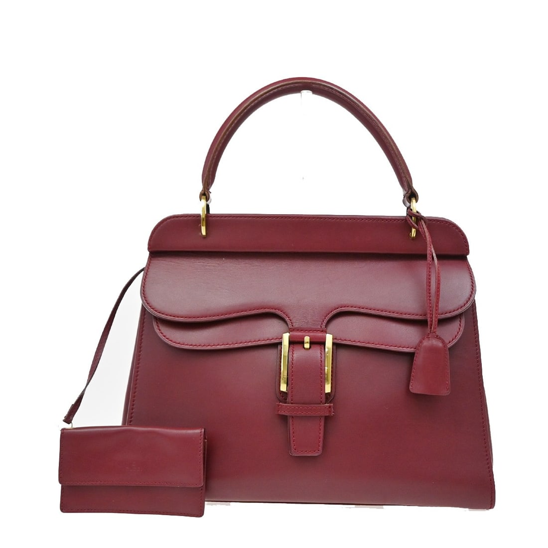 Red Leather Gucci Top Handle Bag with Belt Buckle Design: Red Leather Gucci Top Handle Bag with Belt Buckle Design This Gucci Belt Buckle Top Handle Bag is crafted from red leather and designed for women. It features a structured silhouette with a top handle