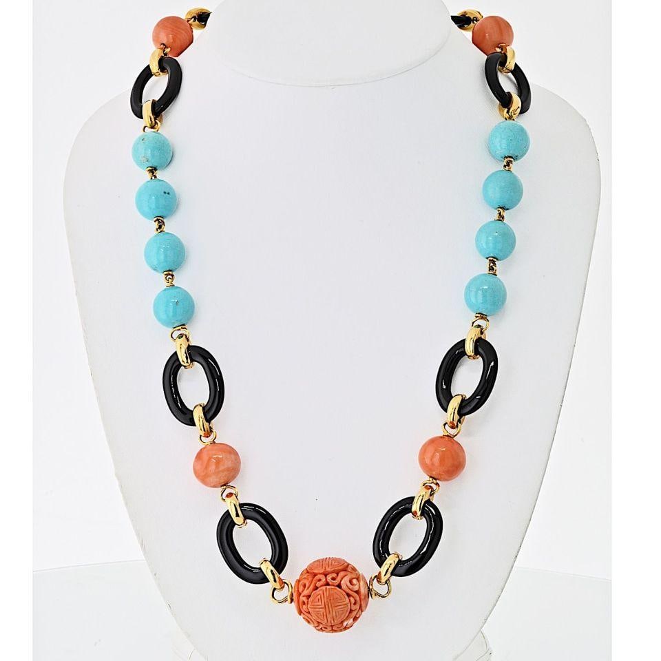 Platinum Gold Necklace With Coral Turquoise Onyx Accents Signed Webb: Platinum Gold Necklace With Coral Turquoise Onyx Accents Signed Webb This necklace by David Webb features a carved Chinese coral centerpiece bead of approximately 27.00 mm, surrounded by large coral b