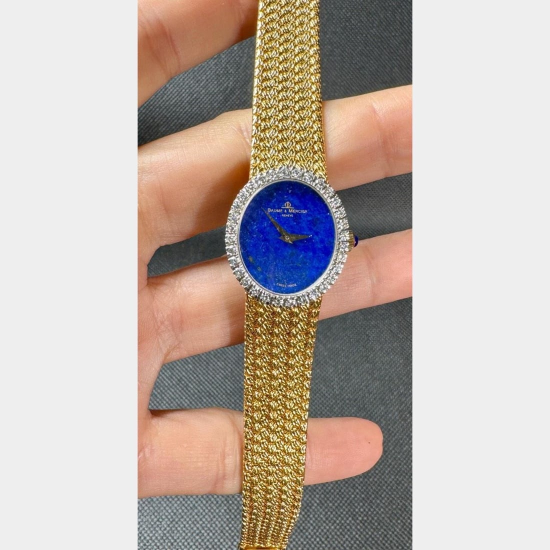 1970s Baume et Mercier 18K Gold Lapis Lazuli Diamond Watch: 1970s Baume et Mercier 18K Gold Lapis Lazuli Diamond Watch This exquisite 1970's Baume et Mercier watch features an elegant 18K yellow gold case and a stunning original lapis lazuli dial. The watch is