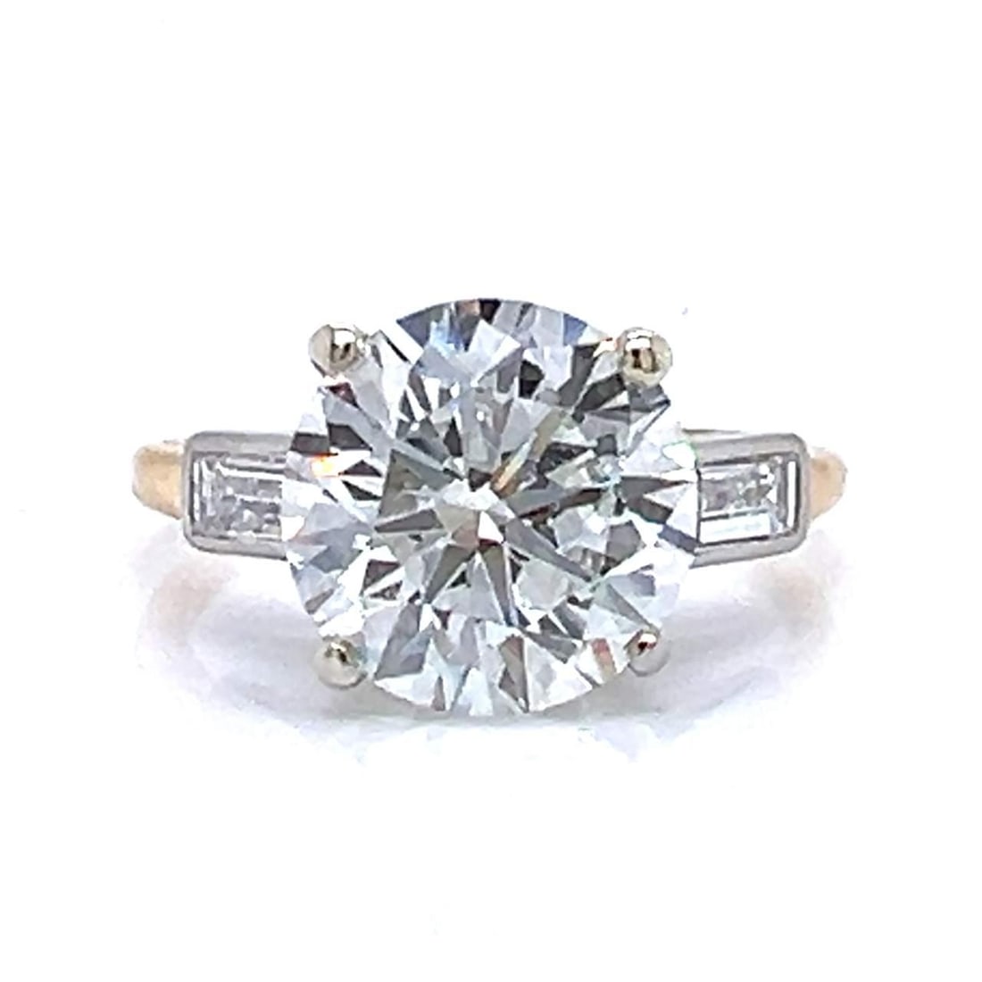 CARTIER 18K Yellow Gold GIA Certified 3.96 Ct Diamond Ring with Baguettes: CARTIER 18K Yellow Gold GIA Certified 3.96 Ct Diamond Ring with Baguettes This exquisite CARTIER ring is crafted from 18K yellow gold and features a stunning GIA Certified diamond weighing 3.96 ct. Th