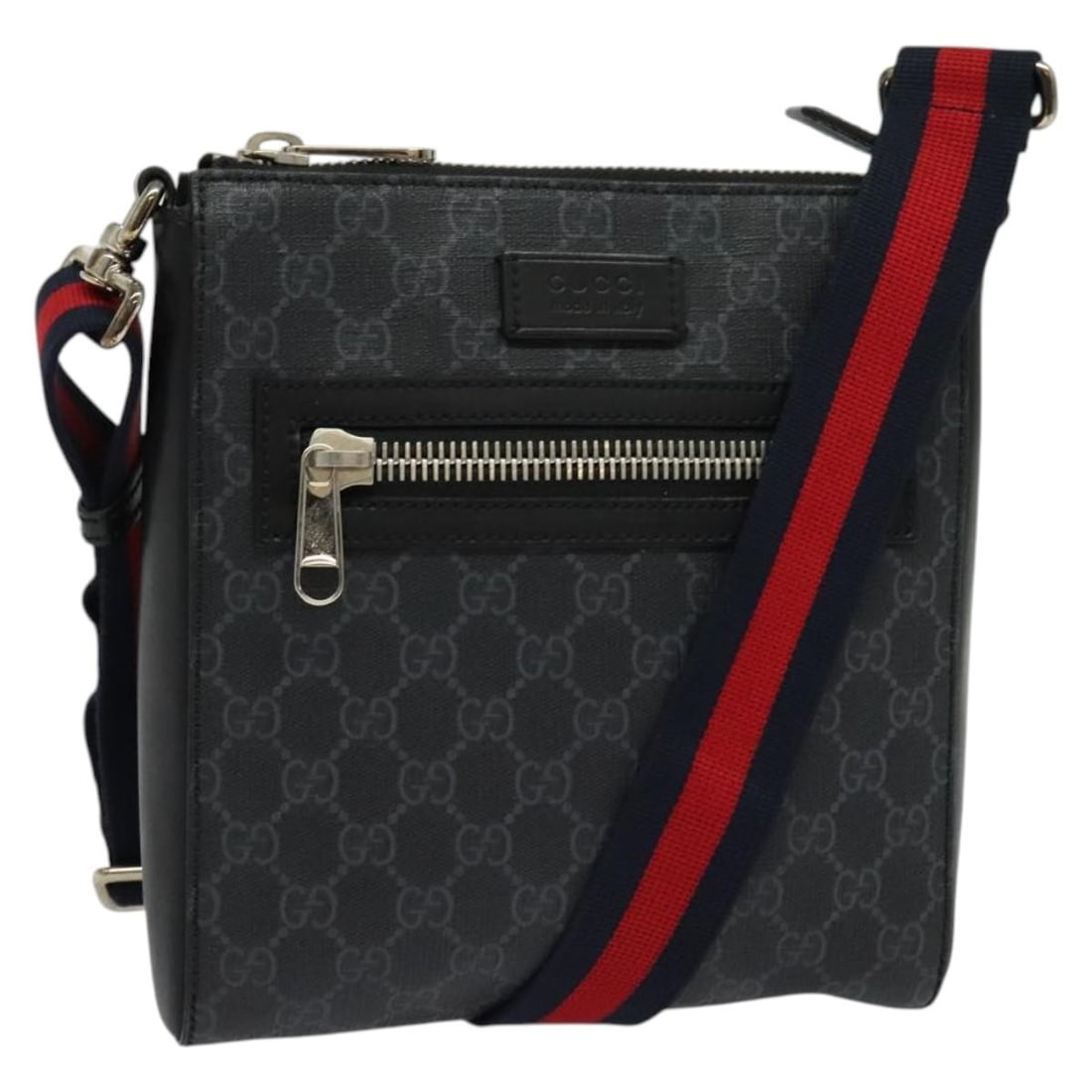 Black GG Coated Canvas Messenger Bag with Gucci Web Strap: Black GG Coated Canvas Messenger Bag with Gucci Web Strap This Gucci Web Strap Front Zip Messenger Bag features a black coated canvas exterior designed for unisex use. It includes a front zip closure