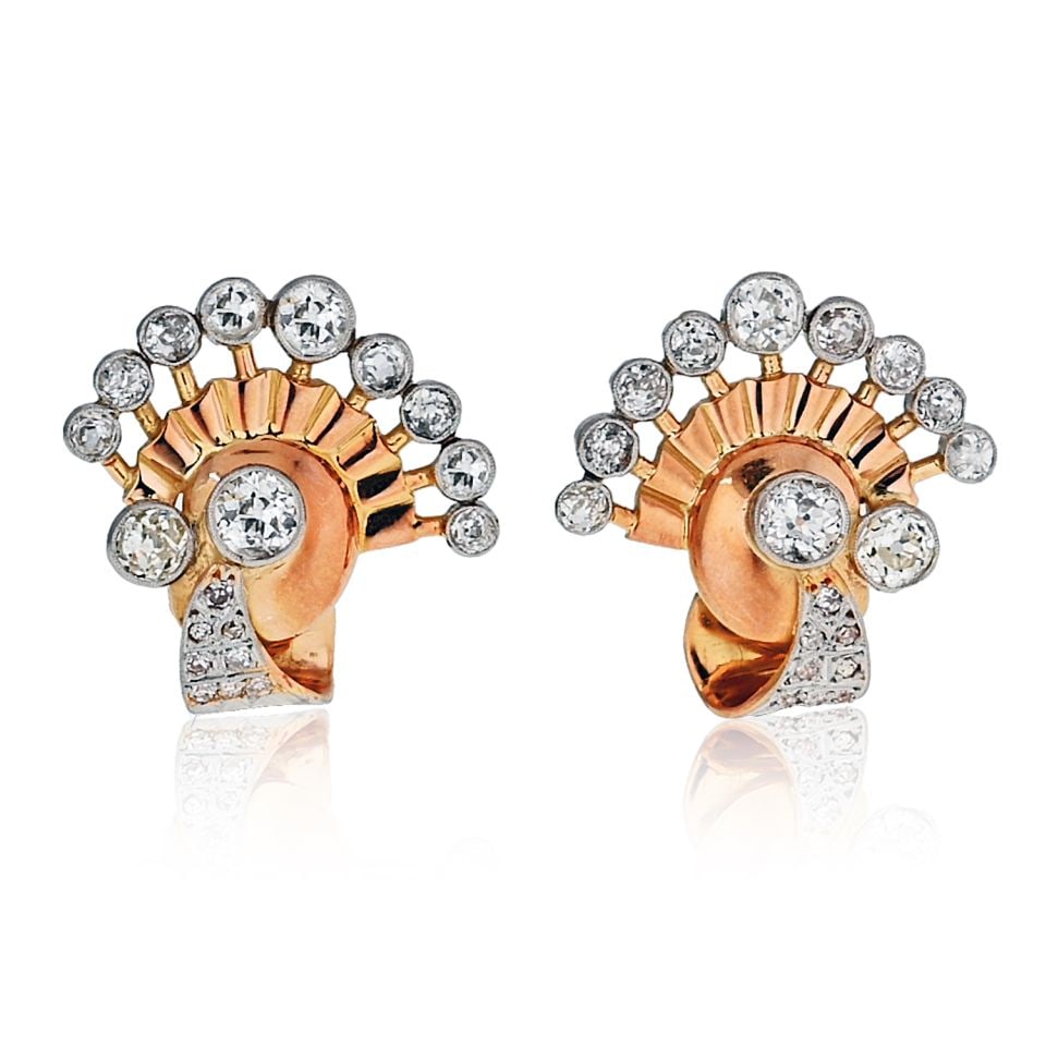 1940s Retro Platinum 18K Gold Diamond Fan Earrings 7 Cts: 1940s Retro Platinum 18K Gold Diamond Fan Earrings 7 Cts These exquisite earrings from the 1940s feature a stunning retro fan style design, crafted from a luxurious combination of Platinum and 18K Yel