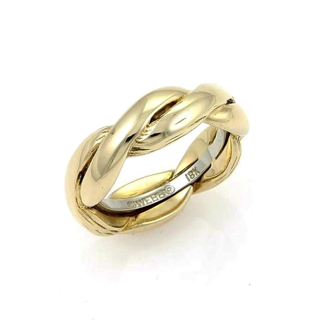 Braided Band Ring in 18k Yellow and White Gold by David Webb Size 6: Braided Band Ring in 18k Yellow and White Gold by David Webb Size 6 This David Webb braided band ring is crafted from solid 18k yellow and white gold, featuring an intricate woven braid design that re