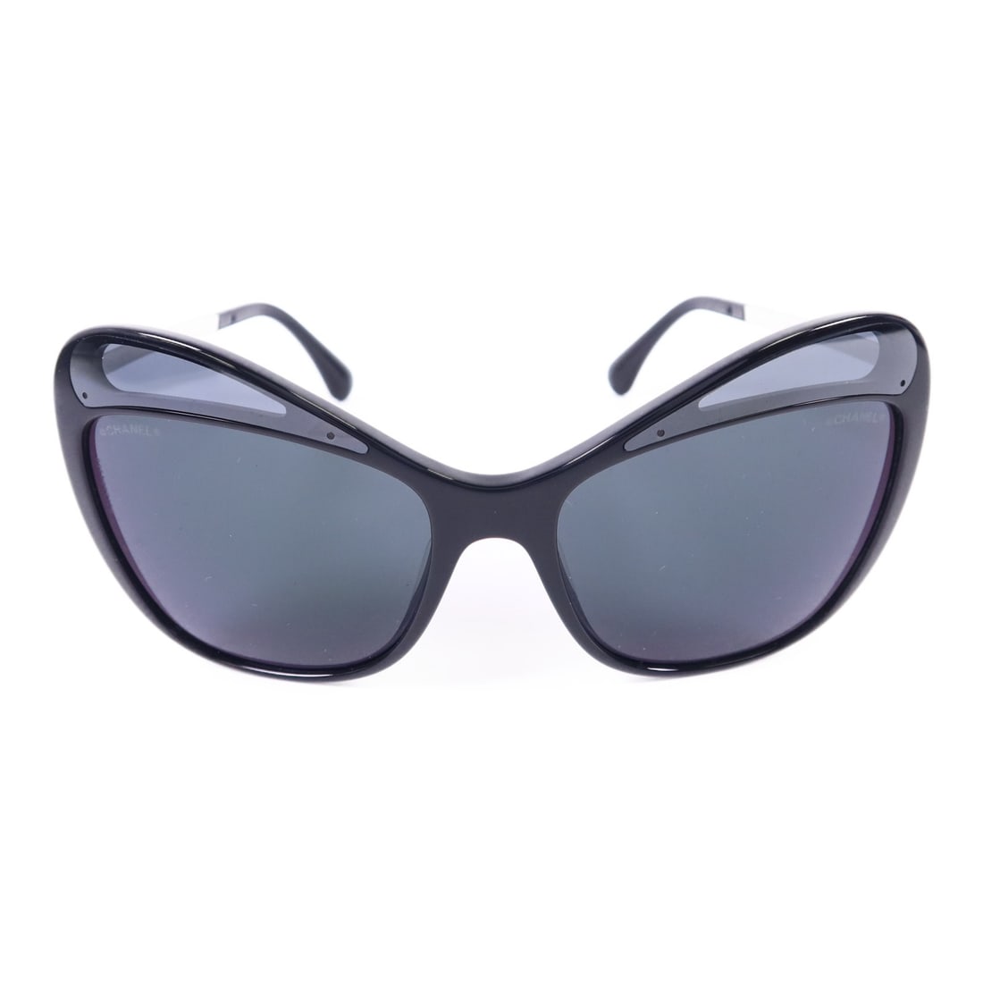 Black and Silver PVC Metal Sunglasses by CHANEL CC: Black and Silver PVC Metal Sunglasses by CHANEL CC These CHANEL sunglasses feature a stylish black PVC and metal frame with silver accents, offering a modern and sophisticated look. Made in France, th