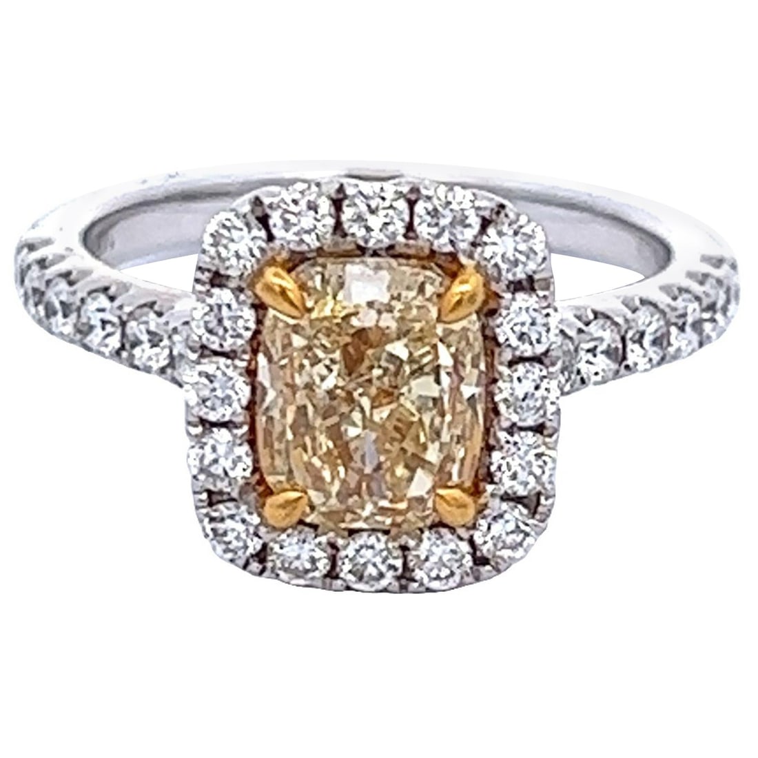 2.03ct Fancy Yellow Diamond Halo Ring 18k Gold EGL Certified: 2.03ct Fancy Yellow Diamond Halo Ring 18k Gold EGL Certified This exquisite 2.03 ct Fancy Yellow VS1 Cushion Diamond Halo Ring is crafted in a stunning two-tone design of 18k yellow and white gold. Th