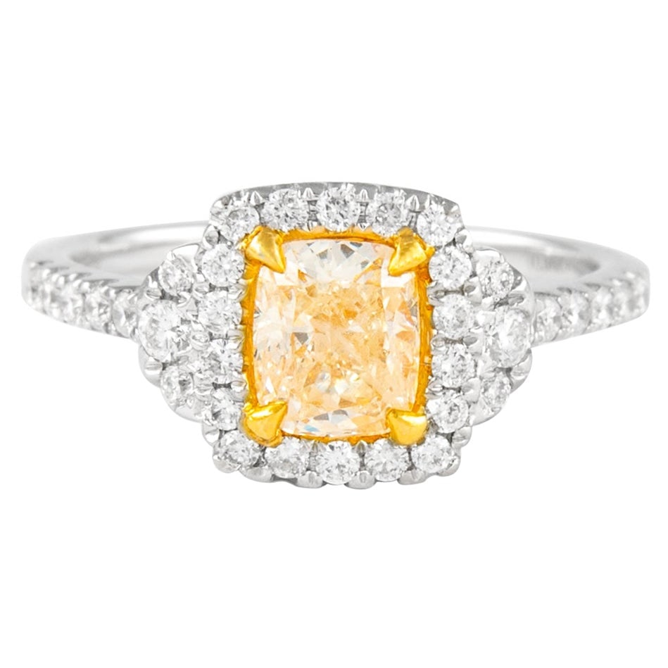 1.38ct Fancy Yellow Diamond Halo Ring 18k Gold EGL Certified: 1.38ct Fancy Yellow Diamond Halo Ring 18k Gold EGL Certified This exquisite ring features a stunning 1.38ct Fancy Yellow Cushion Diamond encircled by a halo of sparkling round brilliant diamonds. Set
