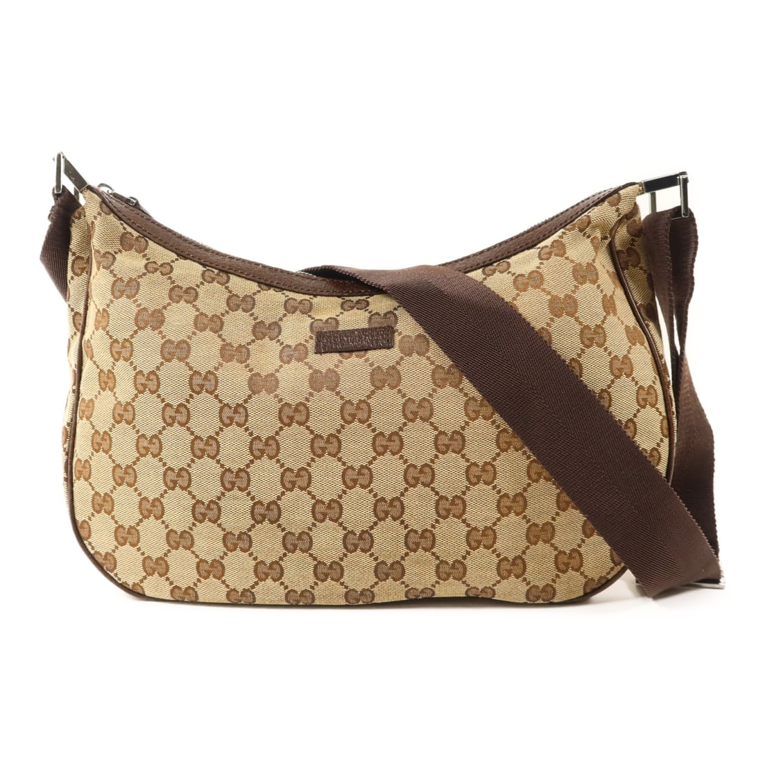 Brown GG Canvas Shoulder Bag by Gucci with Silver Tone Hardware: Brown GG Canvas Shoulder Bag by Gucci with Silver Tone Hardware This Gucci GG shoulder bag features a brown GG canvas exterior and is designed for regular use. Made in Italy, it offers a classic and v
