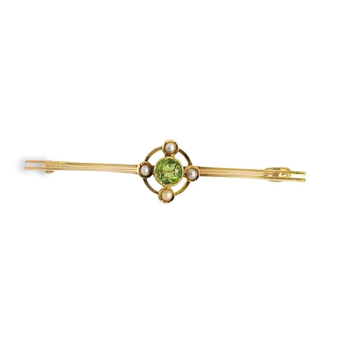 Antique Victorian 14K Yellow Gold Peridot Seed Pearls Target Bar Brooch: Antique Victorian 14K Yellow Gold Peridot Seed Pearls Target Bar Brooch This exquisite Antique Victorian bar pin features a stunning design crafted in 14K solid yellow gold. Adorned with a vibrant gre