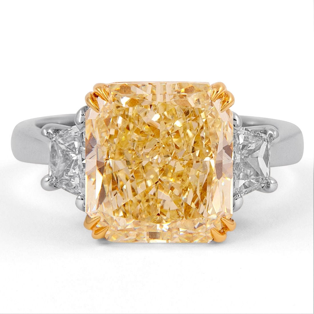 5.24ct Fancy Yellow Diamond Three-Stone Ring GIA Certified 18k Gold: 5.24ct Fancy Yellow Diamond Three-Stone Ring GIA Certified 18k Gold This exquisite three-stone ring features a stunning 5.24ct Fancy Yellow VS2 diamond at its center, radiantly cut and GIA graded. It