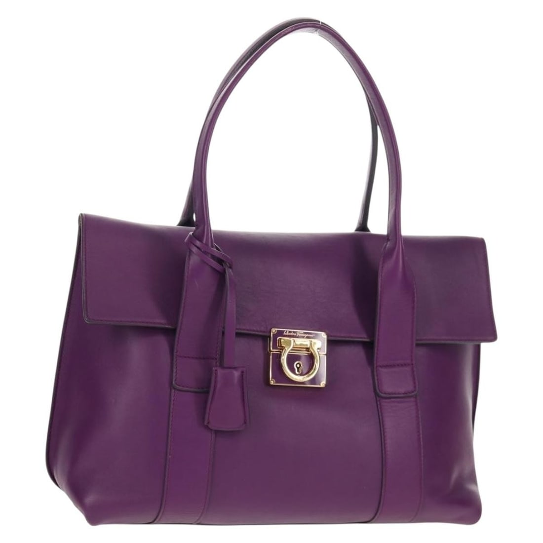 Gancini Lock Flap Tote by Salvatore Ferragamo in Purple Leather: Gancini Lock Flap Tote by Salvatore Ferragamo in Purple Leather This Salvatore Ferragamo Gancini Lock Flap Tote is crafted from purple leather and features a structured silhouette with a signature Gan